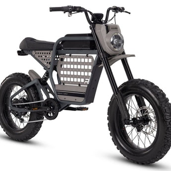 A black Ride1Up Revv1 DRT electric bike with off-road tires and a basket in the front.