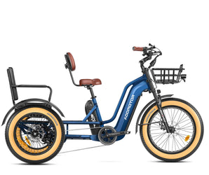 A blue and black GREATTAN electric trike with a passenger seat, front basket, and integrated lights. The trike features a single chainring and is designed for adults.