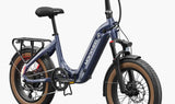 A blue Mokwheel Slate folding electric bike with fat tires, hydraulic front forks, and a rear rack.